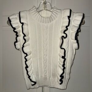 Chic White Ruffled Sweater with Black Trim